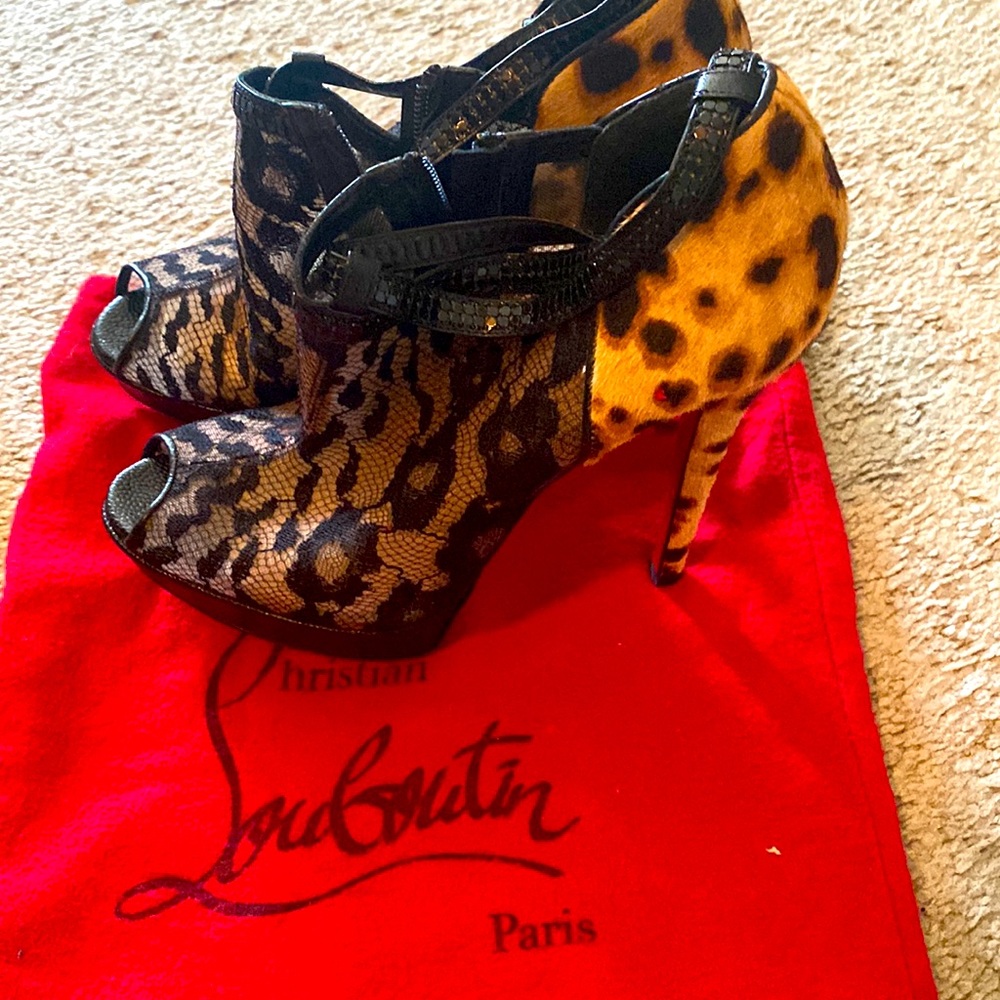 Christian Louboutin great cougar print platform which makes this shoe comfy